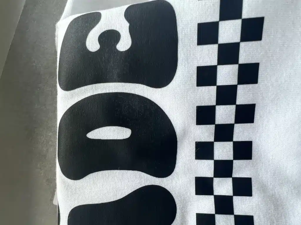 example dtf printed cloth having shiny black spots